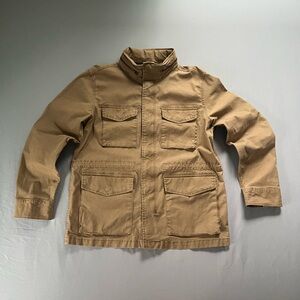 Tan cotton utility jacket with multiple pockets and adjustable waist